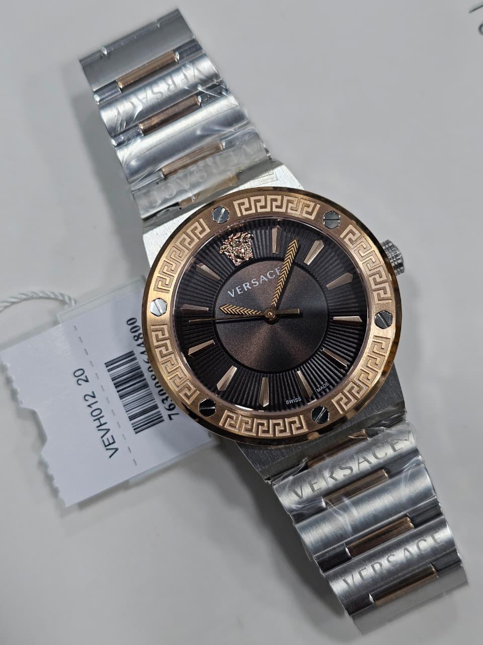 WhatsApp Image 2026-04-16 at 8.54.25 PM (1) Versace Greca Logo Quartz Brown Dial Two-Tone Stainless Steel Watch (VEVH01220) - Image 1